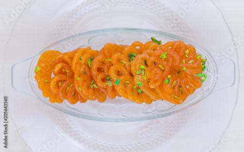 Indian Traditional Sweet Imarti Also Know as Amriti, Omriti, Jahangir, Jalebi, Jaangiri. It is Mde by Deep-Frying Vigna Mungo Flour Batter in a Kind of Circular Flower Shape. photo