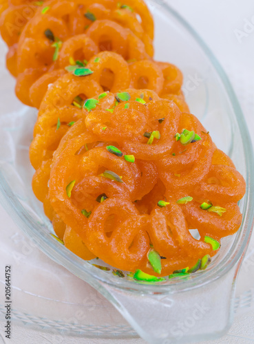 Indian Traditional Sweet Imarti Also Know as Amriti, Omriti, Jahangir, Jalebi, Jaangiri. It is Mde by Deep-Frying Vigna Mungo Flour Batter in a Kind of Circular Flower Shape. photo