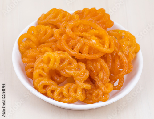 Indian Traditional Sweet Imarti Also Know as Amriti, Omriti, Jahangir, Jalebi, Jaangiri. It is Mde by Deep-Frying Vigna Mungo Flour Batter in a Kind of Circular Flower Shape. photo