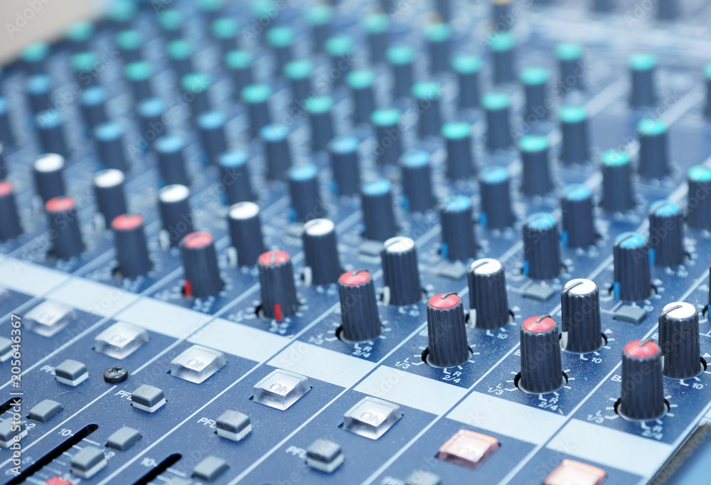 Fototapeta premium Professional audio mixing console. Music Studio. DJ equipment. Focus on foreground