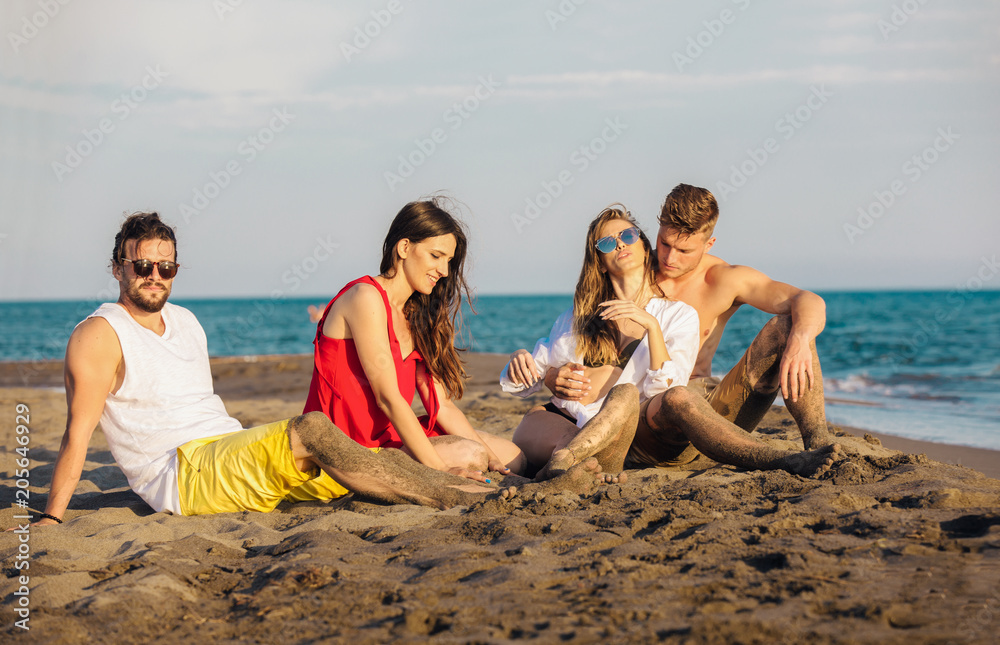 Fototapeta premium Group of friends together on the beach having fun.