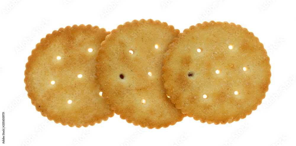 A row of yellow snack crackers on a white background.