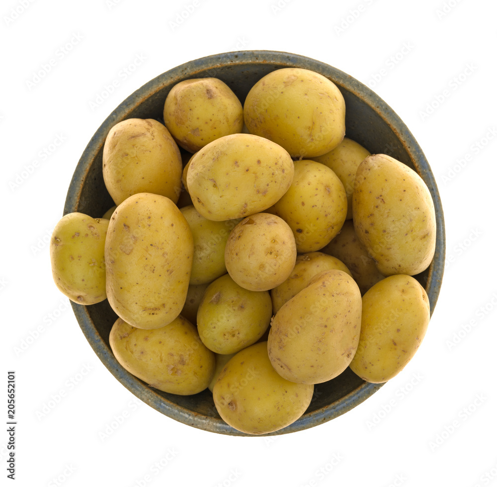 Top view of baby potatoes in a bowl isolated on a white background. Top view of baby potatoes in a bowl isolated on a white background.