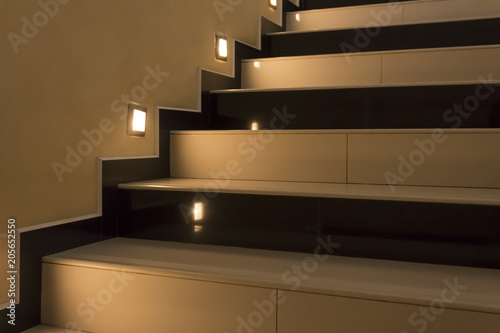 Yellow stairs up with illumination at night