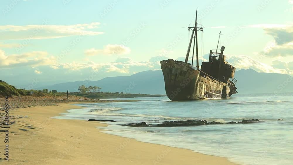 Greek coastline with the famous rusty shipwreck n Glyfada beach near Gytheio, Gythio Laconia Peloponnese Greece. Time lapse Greek coastline with the famous rusty shipwreck n Glyfada beach near Gytheio, Gythio Laconia Peloponnese Greece. Time lapse