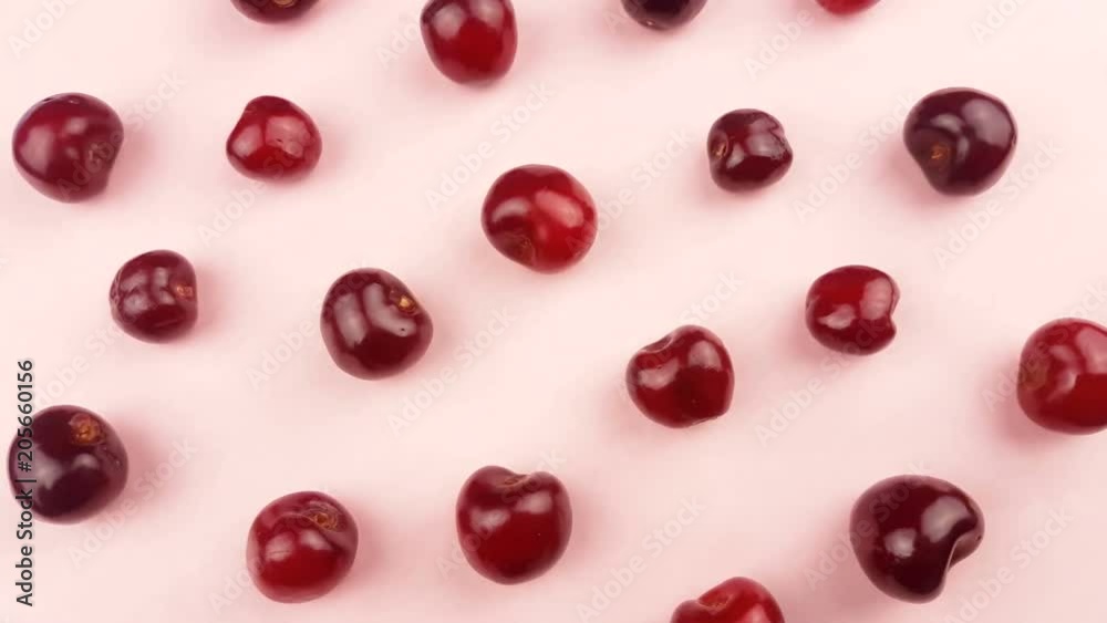 Sweet fresh cherry on pastel pink background.