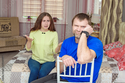 family difficulties - husband and wife conflict at home photo