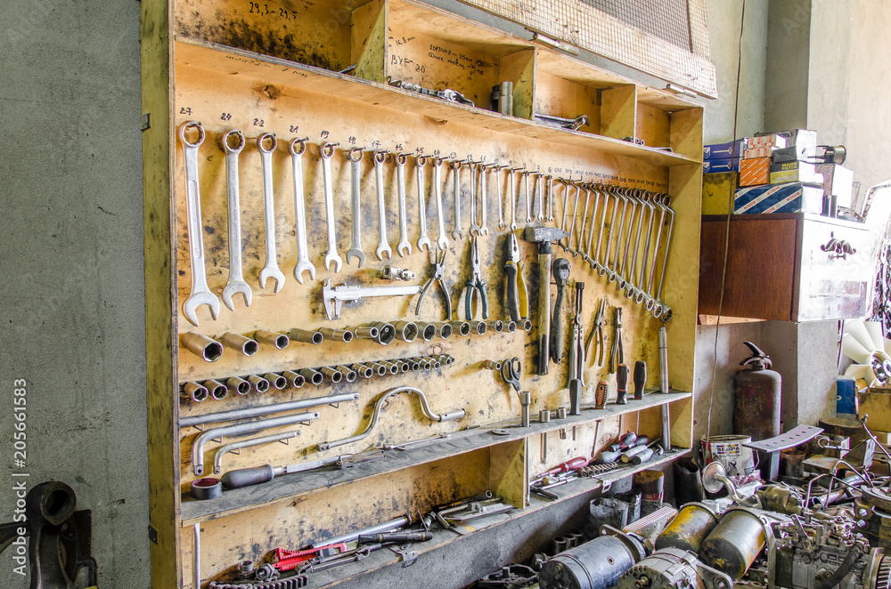 Wooden box with tools on the wall, keys, pliers, screwdrivers Wooden box with tools on the wall, keys, pliers, screwdrivers