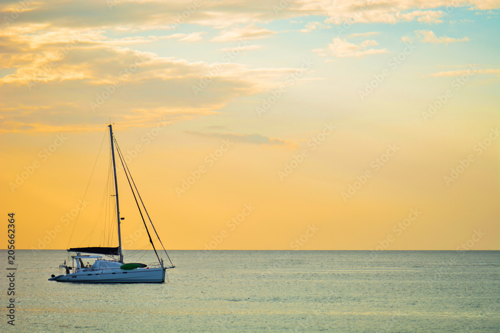 Sailing boat on a background of a beautiful sunset