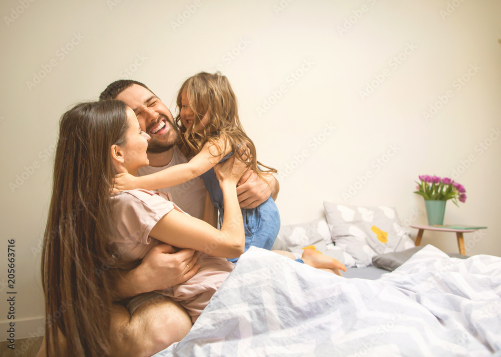 happy family at home in her room celebrating the fourth birthday of her daughter, concept of family relations