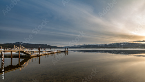 Payette Lake sunrise in winter with boat dock in McCall Idaho