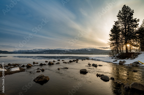 Early morning sunrise in winter over an Idaho mountain lake near McCall