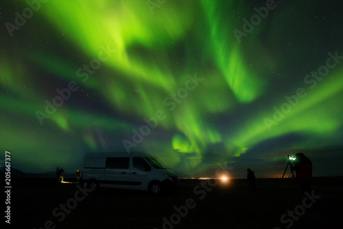 A wonderful night with Kp 5 . Northern lights mountain in Iceland. Soft focus and background blurred.
