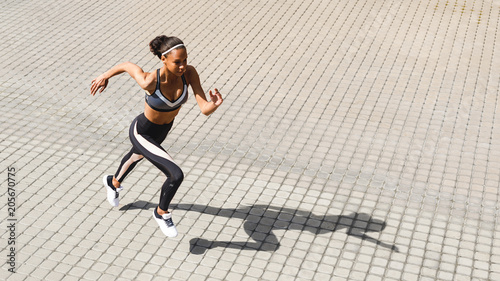 Young fit woman running in the city  copy space