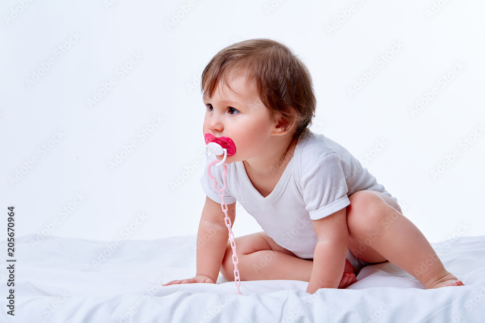 Cute baby girl in white body, crawling, laughing and playing at studio, isolated on white Cute baby girl in white body, crawling, laughing and playing at studio, isolated on white