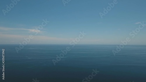 Wallpaper Mural Aerial view: Sea water surface with waves. Flying over the blue ocean with blue water, sky, clouds. Bali,Indonesia.4K video. Travel concept. Aerial footage Torontodigital.ca