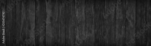 Black wood surface texture as a background, wide panorama