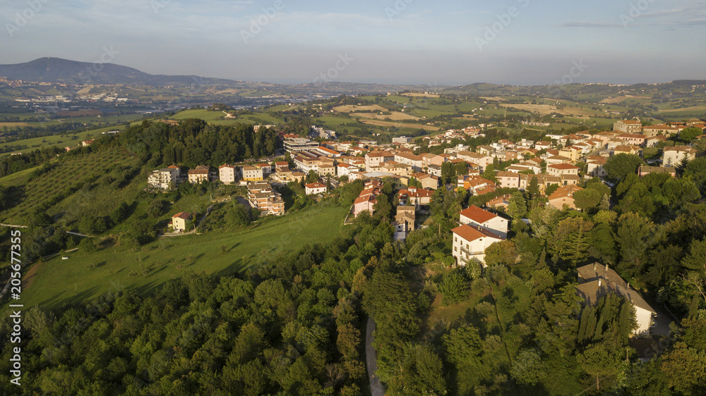 Aerial view of the countryside between Tuscany and Marche in Italy during a beautiful sunny day in summer. The fields are cultivated and the hills are rich in trees and forests. Aerial view of the countryside between Tuscany and Marche in Italy during a beautiful sunny day in summer. The fields are cultivated and the hills are rich in trees and forests.