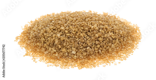 Portion of gold sugar on a white background.