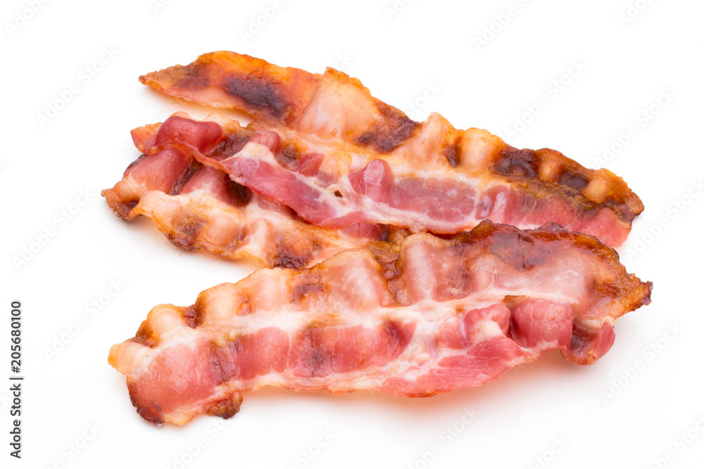 Cooked bacon rashers isolated on white. Cooked bacon rashers isolated on white.