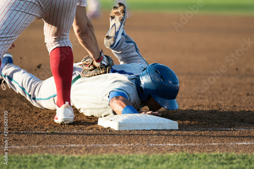 Photography baseball player hitting and sliding