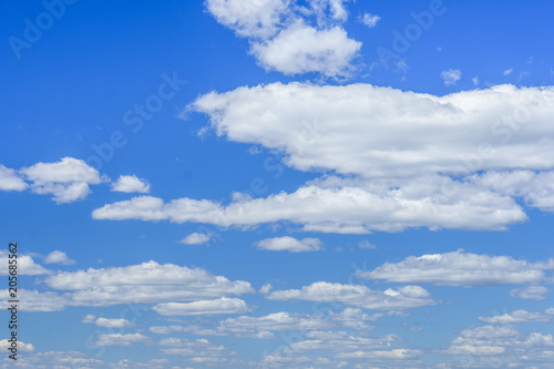 White fluffy clouds in a deep blue sky