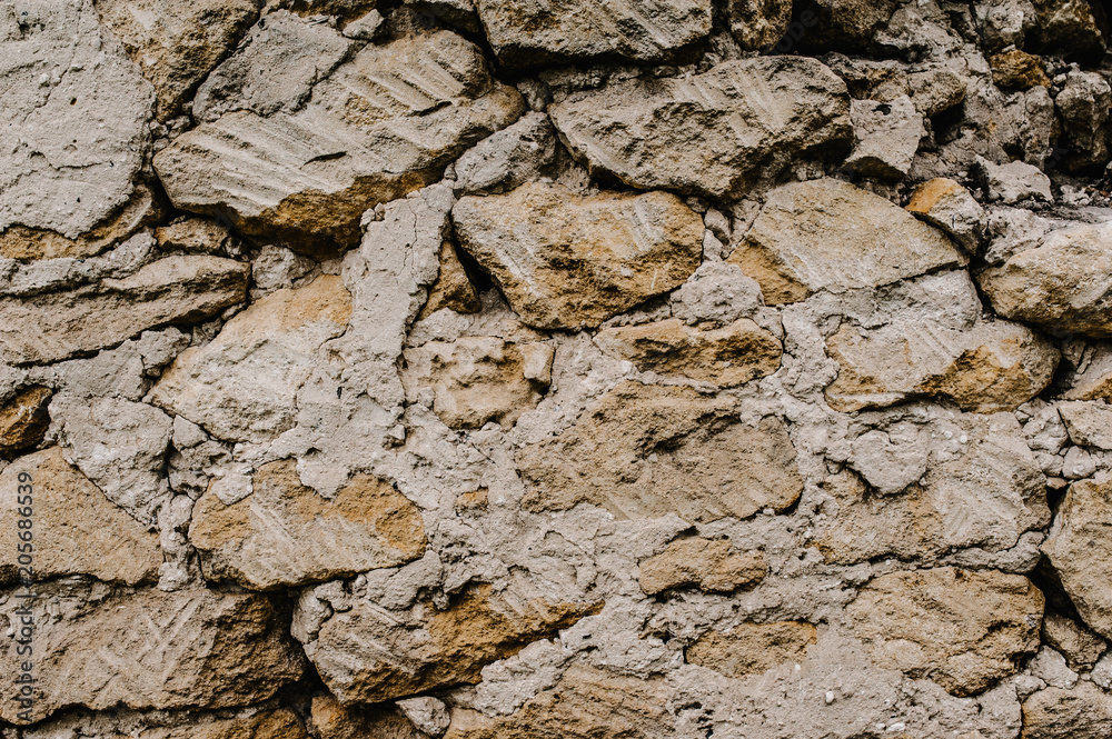 Fototapeta premium Background, texture, stone..Abstract texture grunge old wall.Brown grunge wall - Great textures for design.Stone wall. Background of large concrete bricks. Big pile of stones as a background