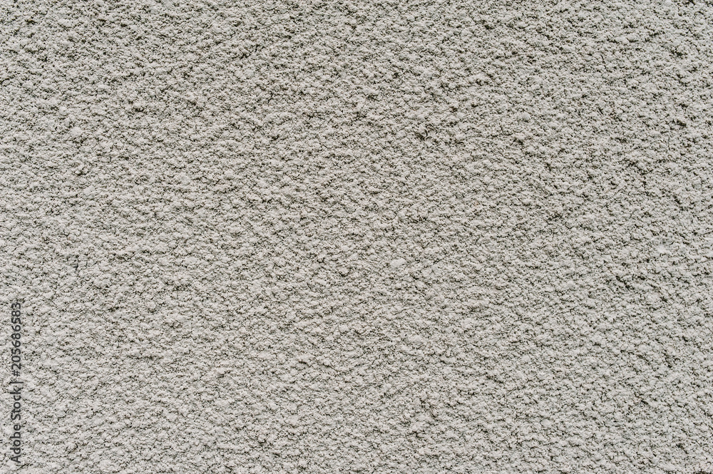 White, gray texture background wall..Cement plaster. A rigid structure White, gray texture background wall..Cement plaster. A rigid structure