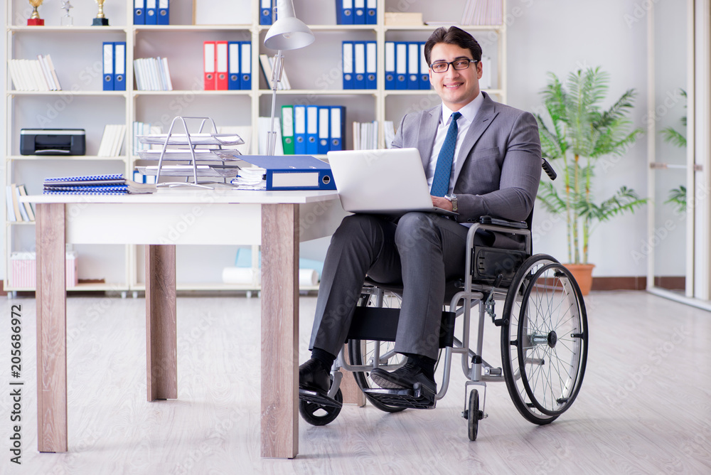 Disabled businessman working in the office Disabled businessman working in the office