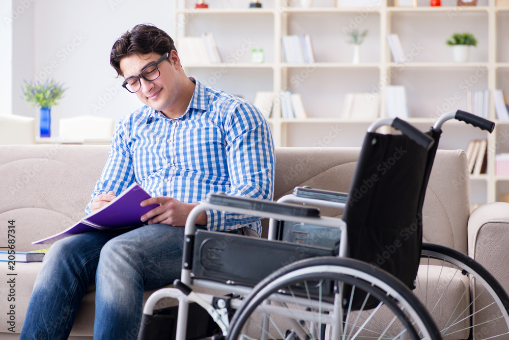 Young student on wheelchair in disability concept Young student on wheelchair in disability concept