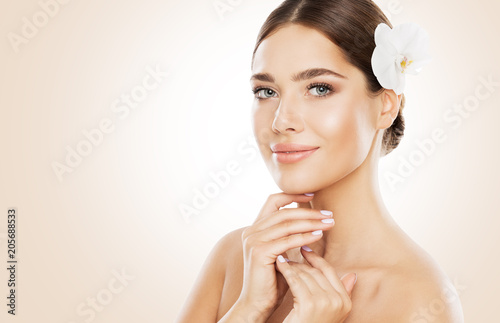 Woman Beauty, Face Skin Care and Natural Make Up, Girl with Orchid Flower in Straight Hair, Beautiful Makeup and Skincare