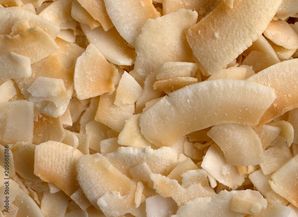 Close view of toasted coconut flakes. Close view of toasted coconut flakes.