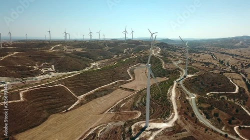 Aerial view of windmills in the mountains, wind power turbines. Wind turbine close-up.