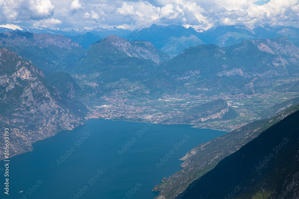 Panorama of the gorgeous Lake Garda surrounded by mountains in Monte Baldo Macesine, Provincia di Verona, Veneto, Italy
