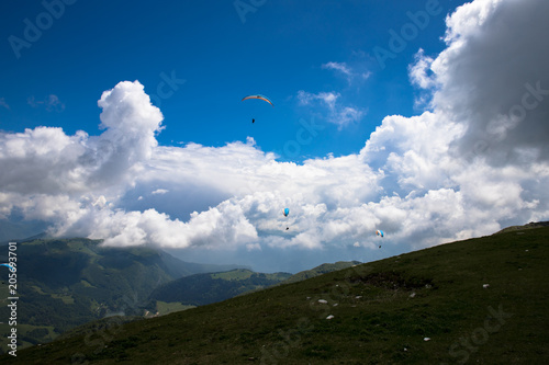 Paragliders in the air at Lake Garda region and Monte Baldo Macesine, Provincia di Verona, Veneto, Italy