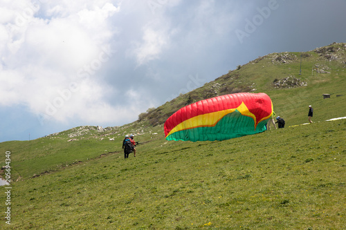 Paragliders in the air at Lake Garda region and Monte Baldo Macesine, Provincia di Verona, Veneto, Italy