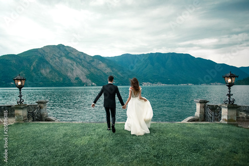 wedding couple the background of the lake and mountains