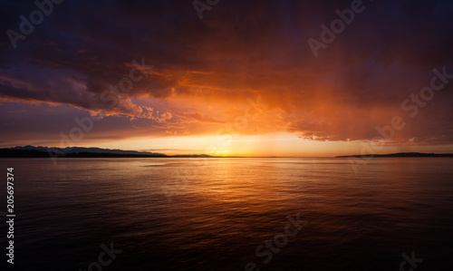 Beautiful Sunset or Sunrise Lighting Fire to the Clouds and Ocean