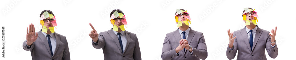 Businessman with many reminders isolated on white Businessman with many reminders isolated on white