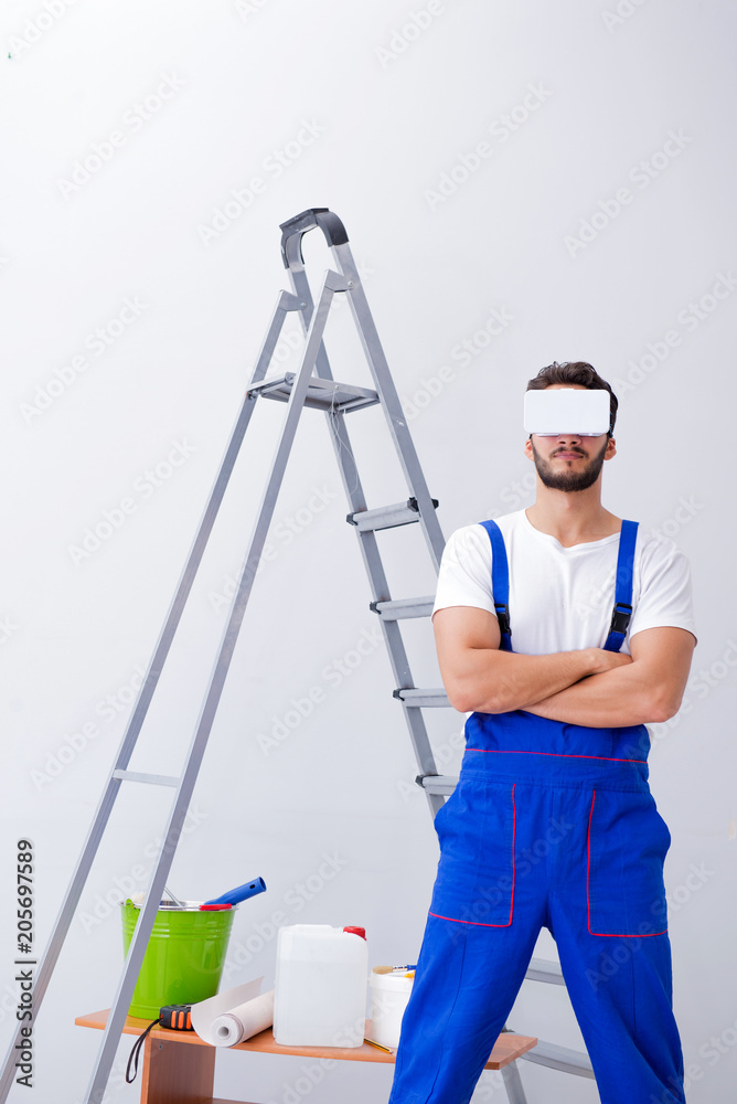 Man with VR glasses gluing wallpaper Man with VR glasses gluing wallpaper