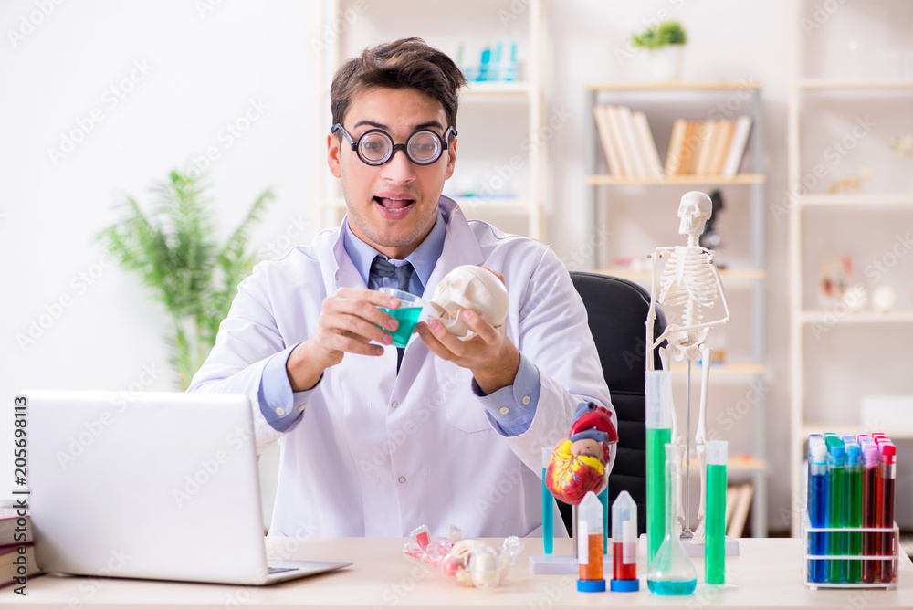 Funny doctor having fun in hospital lab Funny doctor having fun in hospital lab