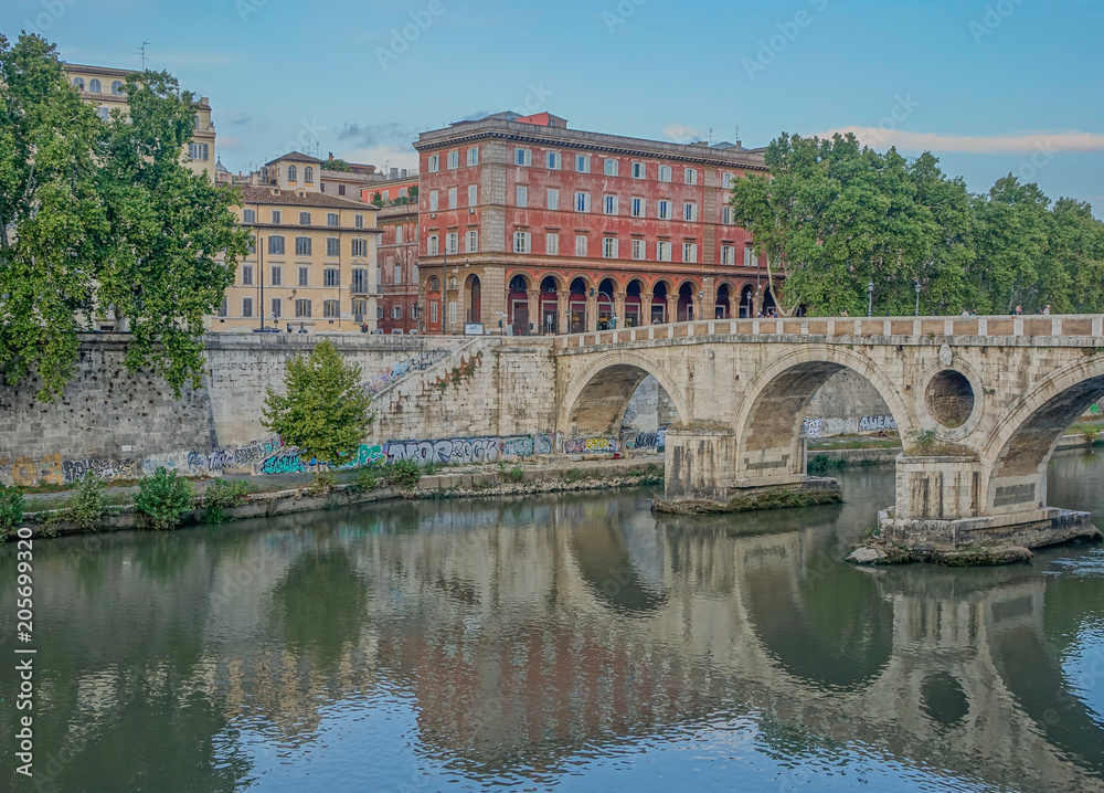 Rome, Lazio, Italy - September 12, 2017: View of Ponte Sisto with reflections on the Tiber river at a sunset in Rome
