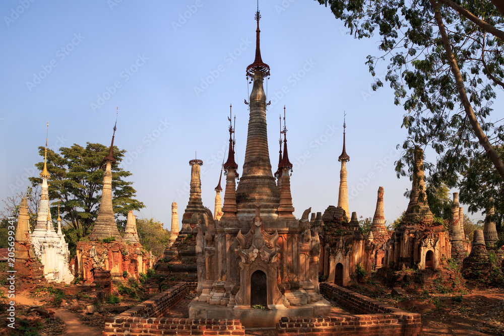 Ruins of ancient pagodas made of brick, stone, and clay at Shwe Inn Thein near Inle Lake, Myanmar Ruins of ancient pagodas made of brick, stone, and clay at Shwe Inn Thein near Inle Lake, Myanmar
