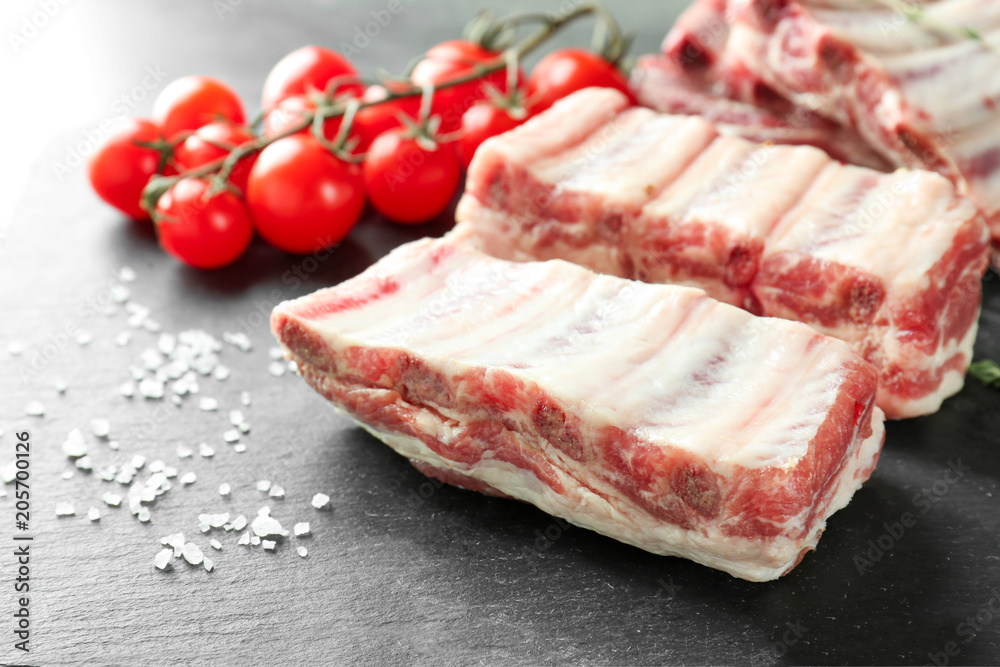 Fresh raw ribs on slate plate Fresh raw ribs on slate plate