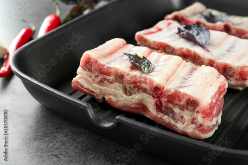 Grill pan with fresh raw pork ribs, closeup