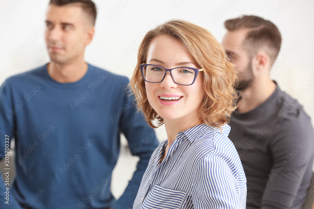 Female psychologist at group psychotherapy session indoors Female psychologist at group psychotherapy session indoors