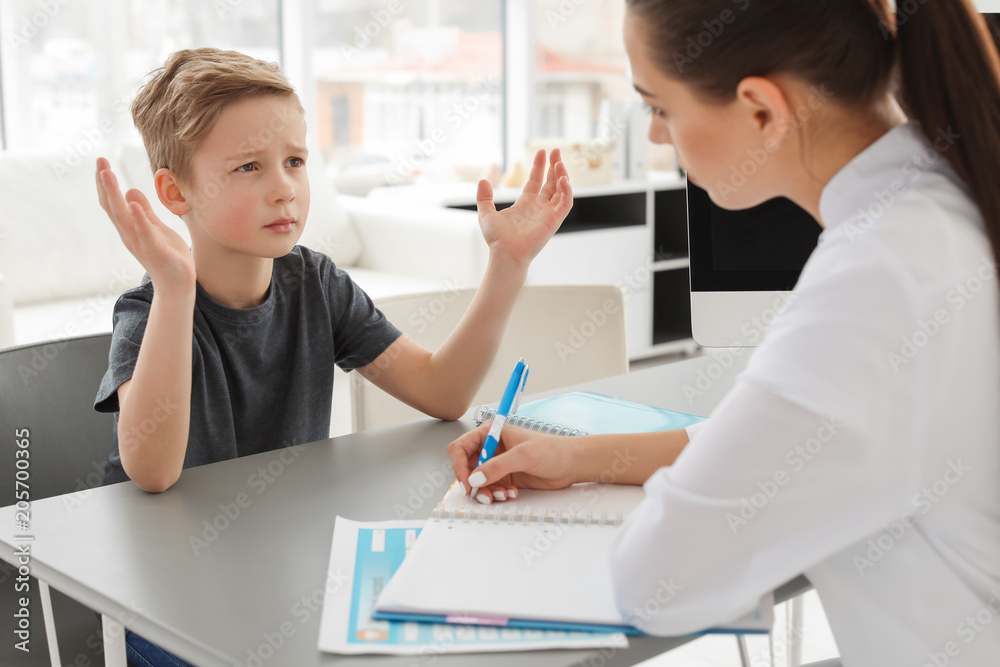 Fototapeta premium Little boy having appointment at child psychologist office