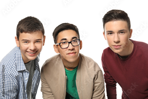 Stylish teenage boys on whi...