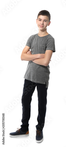 Cute teenage boy on white b...