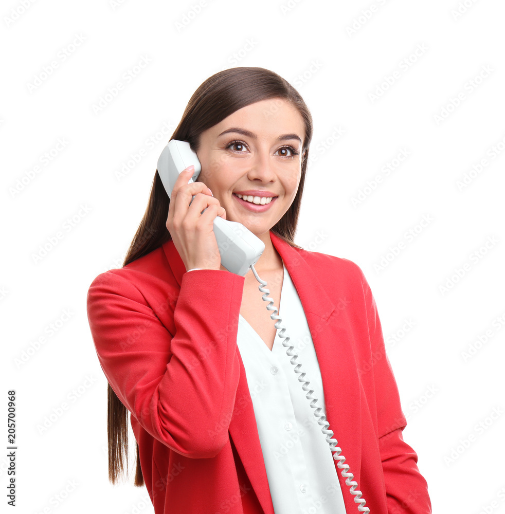 Young woman talking on phone against white background Young woman talking on phone against white background